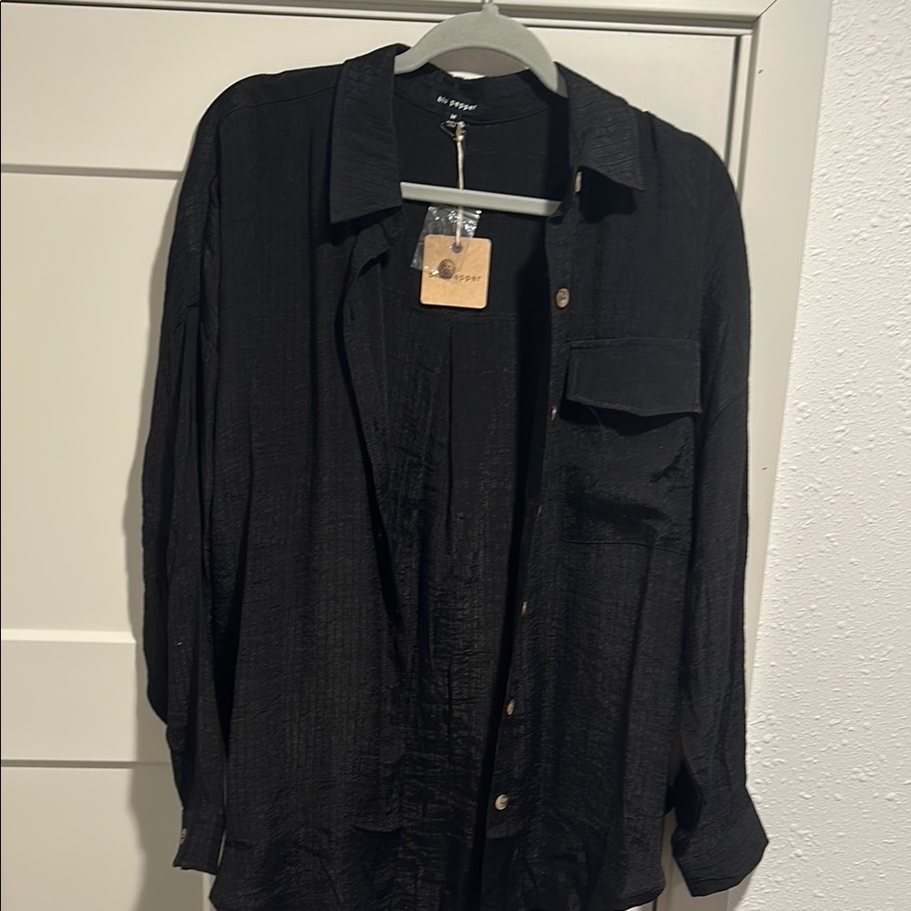 Women’s oversized button up blouse